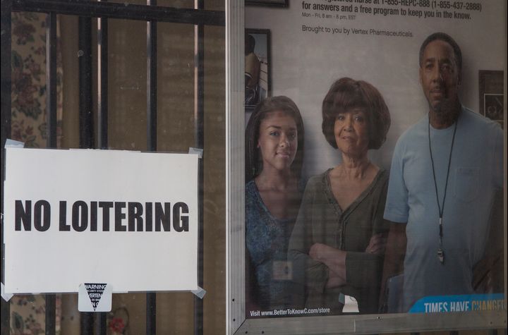 A no loitering sign in East Liberty displayed next to an image of a Black family, with a caption reading “Times Have Changed.”