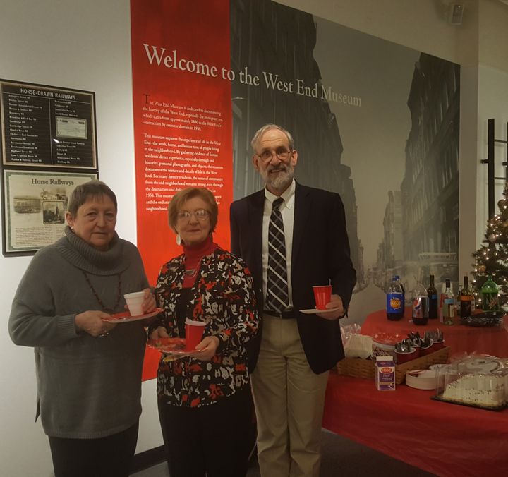 Museum Director Susan Hanson, attendee Una McMahon, and board member Bill Kuttner at the West End Museum holiday party.