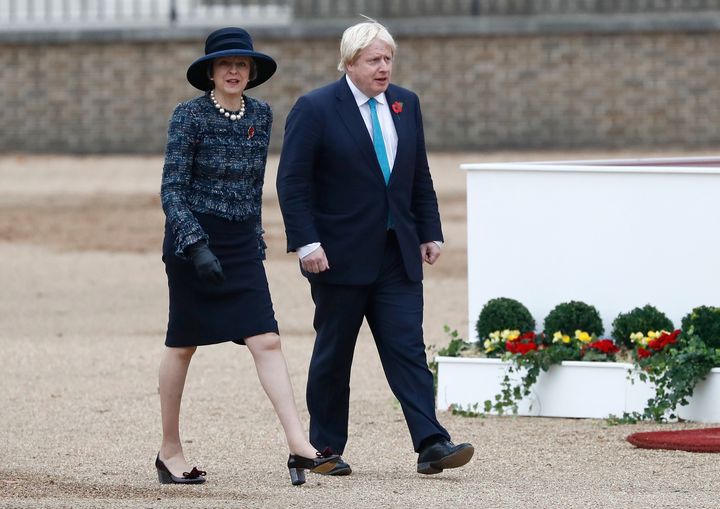 Britain's Prime Minister Theresa May and Foreign Secretary Boris Johnson arrive for a ceremony in November