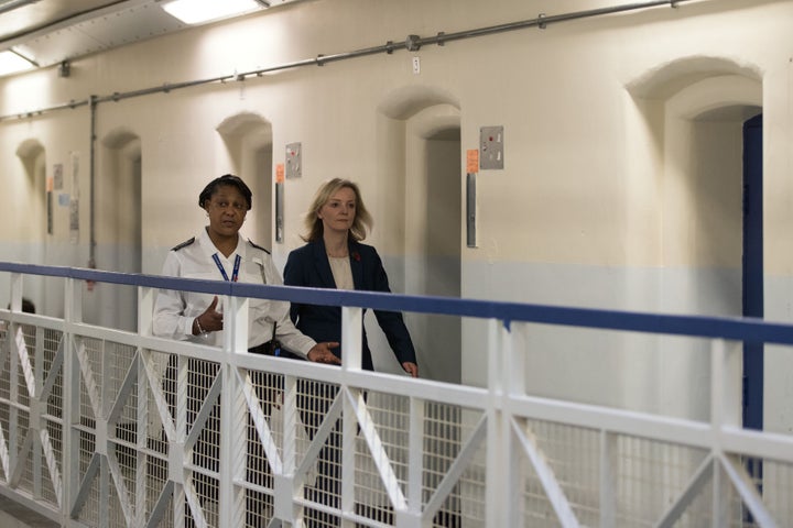 Justice Secretary Liz Truss, seen here right on an earlier prison visit, spoke on Saturday