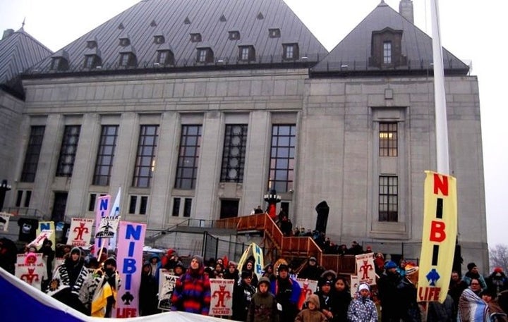 Protesters rally in front of the Supreme Court of Canada in Ottawa for the hearing in the Clyde River case.