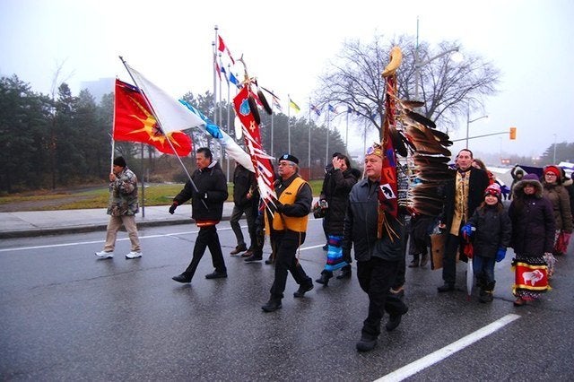 Protesters march toward the Supreme Court of Canada in Ottawa on November 30, 2016.