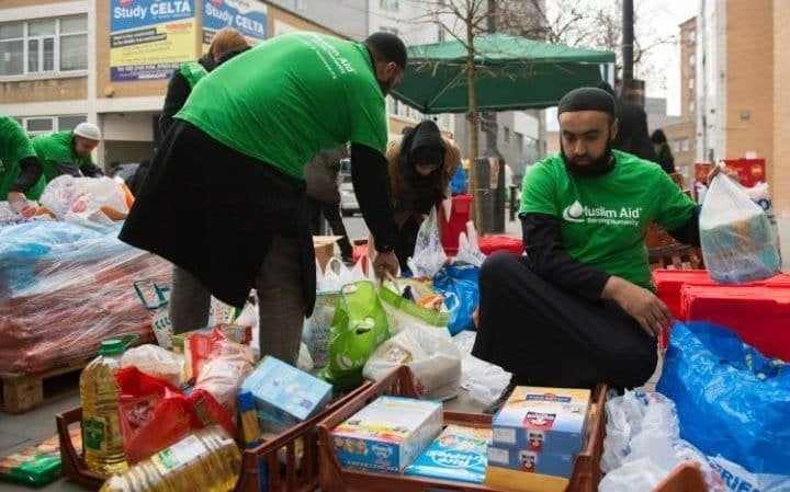 Volunteers from Muslim Aid sort through the donations.