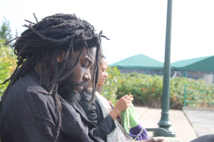 Lesley-Anne Brown of the Rhode Island Writer’s Colony, says of the photo with Jason Reynolds, “ I was knitting a baby blanket for Karen Good Marable's baby girl. I can't remember what Jason Reynolds was reading tho' “