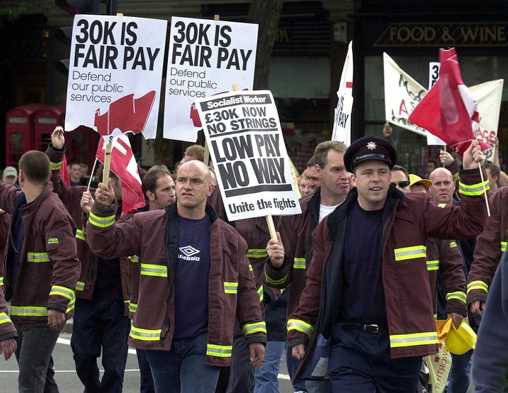 Firefighters march to Trafalgar Square, London, for a rally to demand a pay increase in 2003.