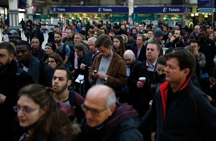 <strong>Passengers queue for a reduced during the Southern railway strike at Victoria station in London.</strong>