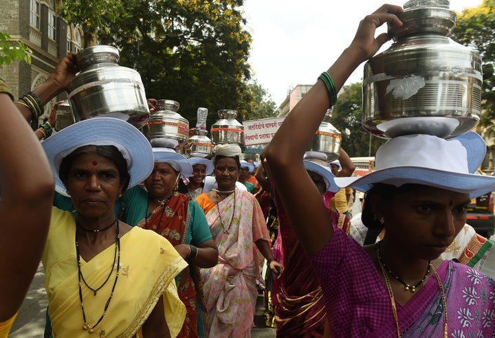 Indian villagers from drought affected areas carry pots as they take part in a rally to spread awareness on water usage in Mumbai on May 17.