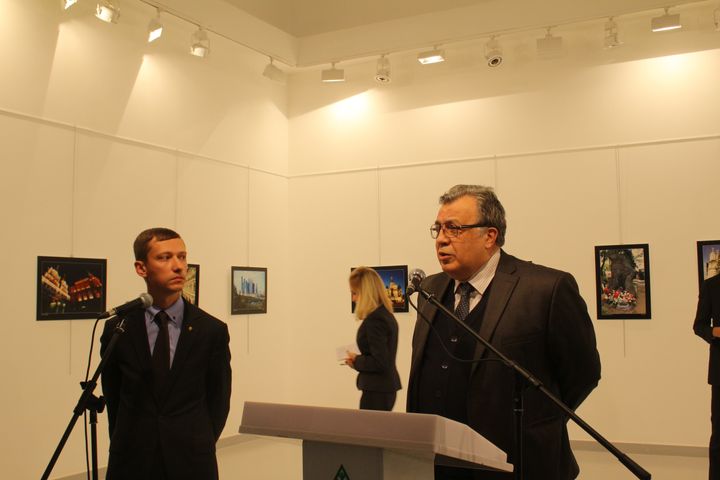 Russian Ambassador to Turkey, Andrei Karlov (R) gives a speech as he visits an art fair at Modern Art Center in Ankara, Turkey on December 19, 2016.