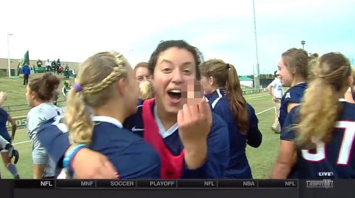 Former University of Connecticut soccer player Noriana Radwan flips off the camera while celebrating her team winning the 2014 American Athletic Conference championship game.