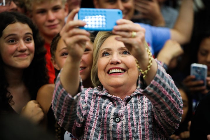 Clinton takes a selfie with supporters after a campaign rally on June 5, 2016. 