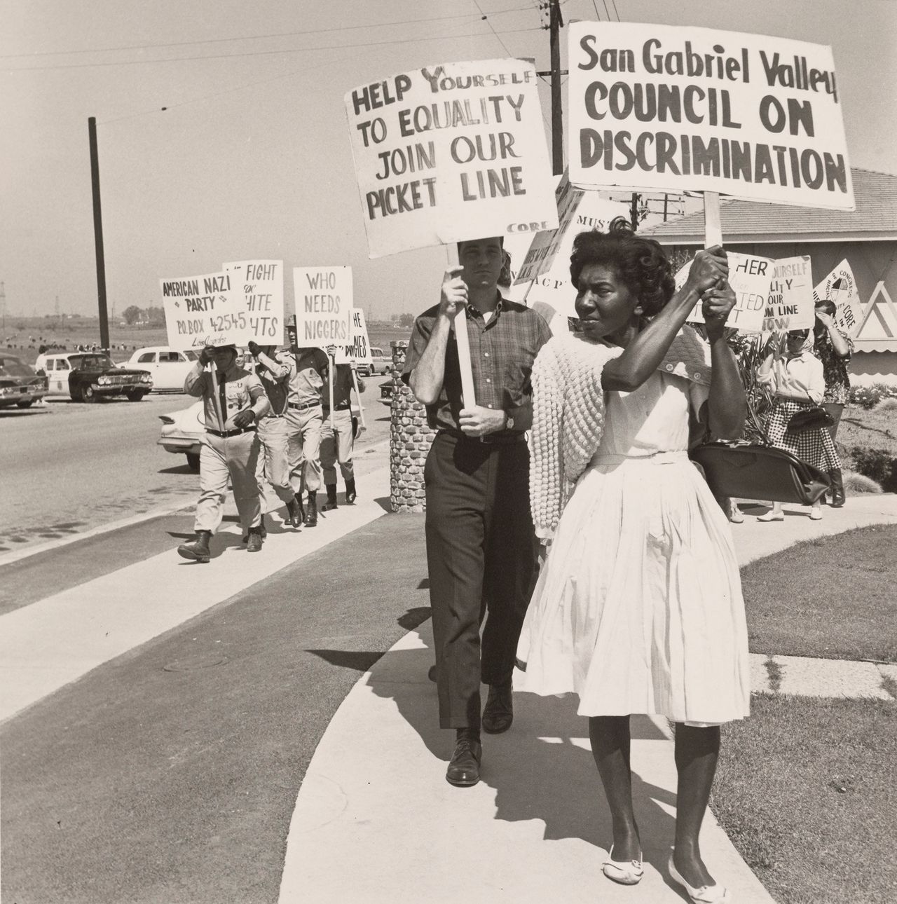 A photo of civil rights advocates picketing next to the American Nazi Party put our country's current politics into sharp relief.