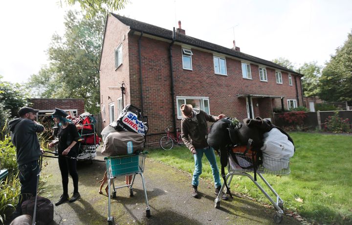 Squatters remove their belongings during an eviction from a home next to a housing estate in north London, Britain, September 24, 2015.