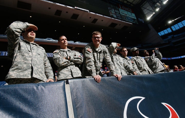 Servicemen are seen in the stands on Salute to Service Day prior to the start of the game between the Cincinnati Bengals and the Houston Texans at NRG Stadium on November 23, 2014 in Houston, Texas.