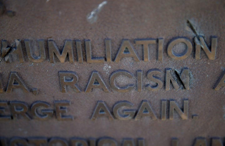 The words racism and humiliation are shown on a plaque at Manzanar National Historic Site on December 9, 2015 near Independen