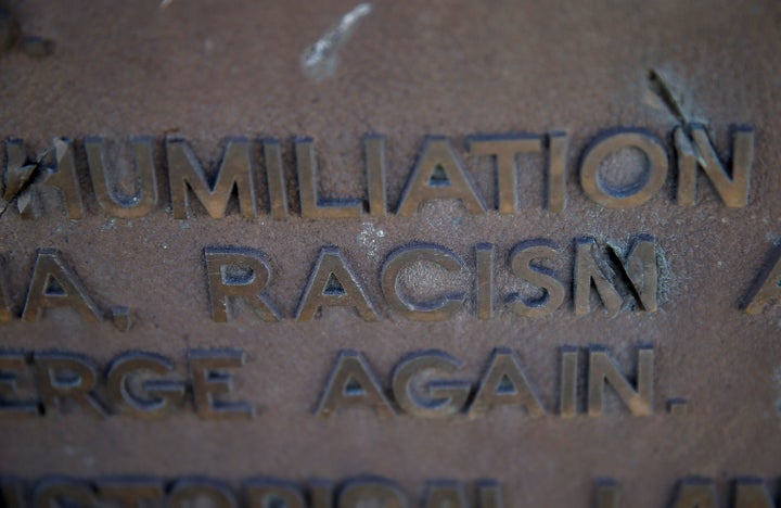 The words racism and humiliation are shown on a plaque at Manzanar National Historic Site on December 9, 2015 near Independence, California.