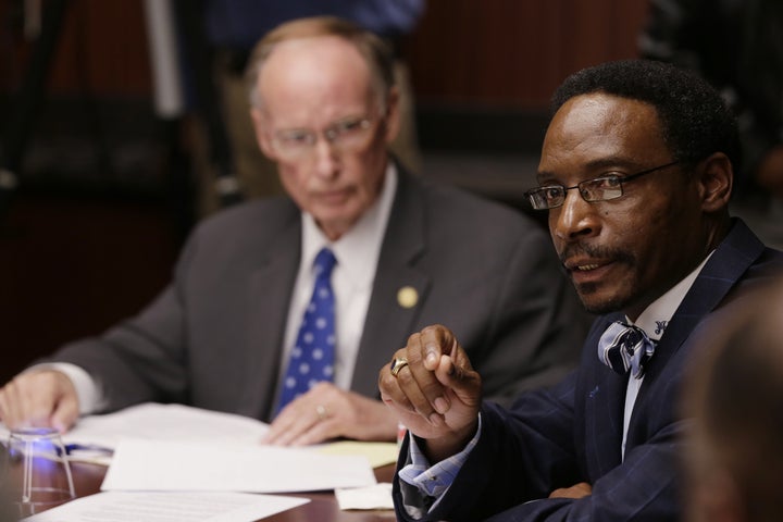 Alabama State University Board of Trustee member Marvin Wiggins, right, talks with other board members during a meeting on the campus in Montgomery, Ala., Monday, Oct. 28, 2013. Gov. Robert Bentley, left, called the trustees to the meeting to discuss critical findings about medicaid expenditures by a forensic auditor. (AP Photo/Dave Martin)