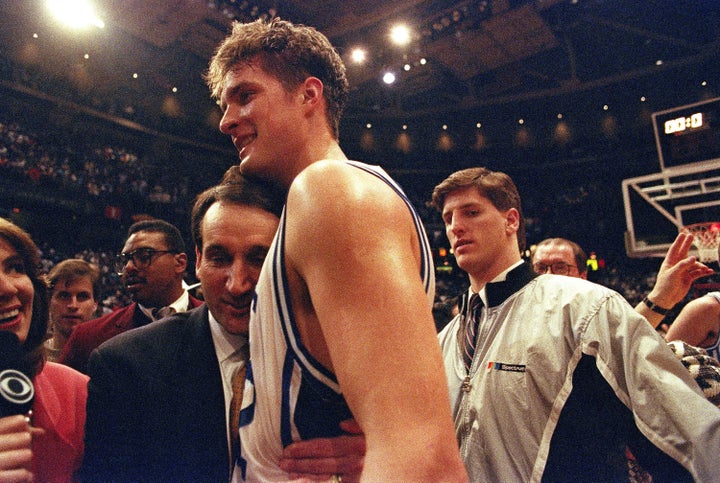 Krzyzewski embraces Christian Laettner after he famously beat Kentucky with a program-defining buzzer-beater in the 1992 East Regional Final.