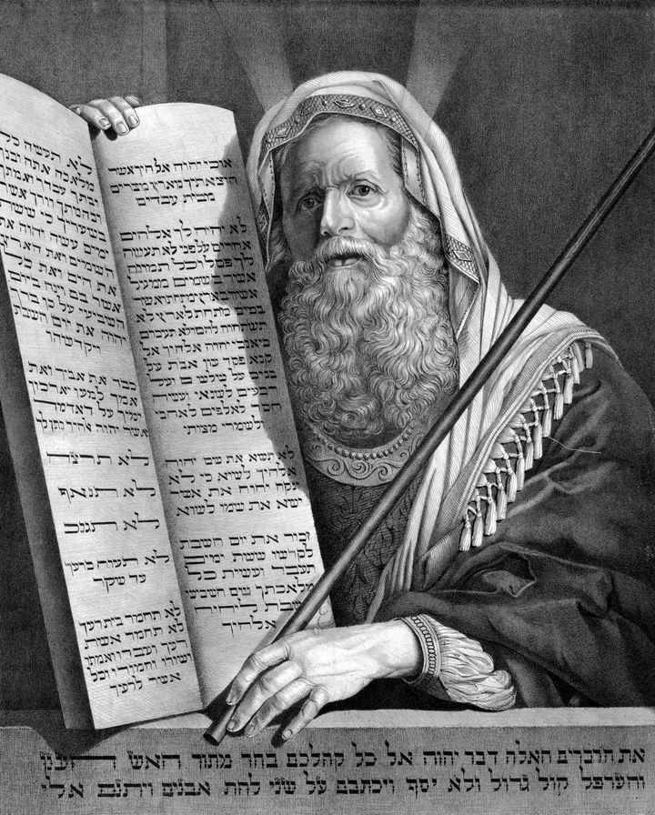 A vintage engraving featuring Moses and the Ten Commandments.