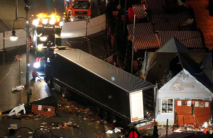 A tow truck operates at the scene where a truck plowed through a crowd at a Christmas market on Breitscheidplatz square in Berlin.