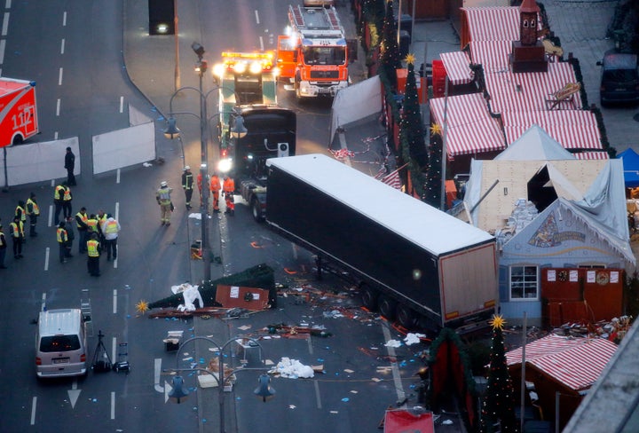 A tow truck operates at the scene where a truck ploughed through a crowd at a Christmas market on Breitscheidplatz square.