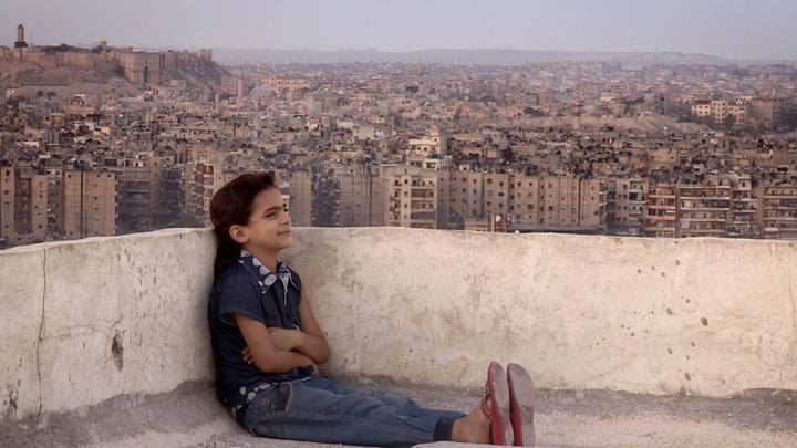 Farah on an Aleppo rooftop, before she and her family fled.