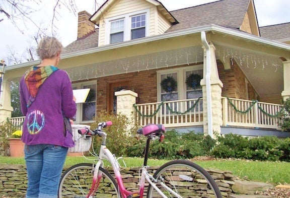 The artist at work depicting “homes as opposed to houses”