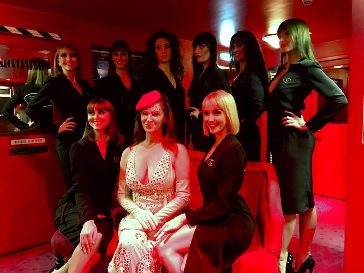 <p>Author Leslie Zemeckis surrounded by the cast of The Crazy Horse</p>