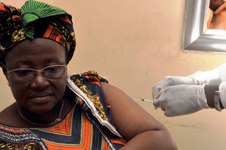 A woman gets vaccinated on March 10, 2015 at a health center in Conakry during the first clinical trials of the VSV-EBOV vaccine against the Ebola virus. The World Health Organization (WHO) said on March 5 that clinical trials launched on March 7 in Guinea marked the last step before the vaccine is available on the market.