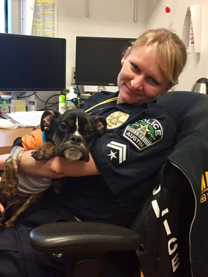 <p>Officer Ewa Wagner cuddles Sophie a few days after she helped rescue her</p>