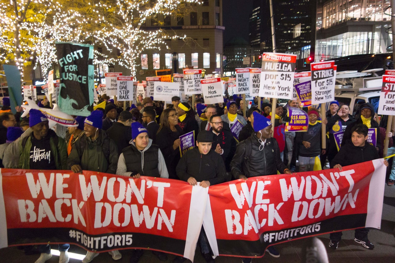 Fast food workers, supported by airport workers taxi drivers and members of the community, rally at McDonalds to fight for a $15 an hour wage