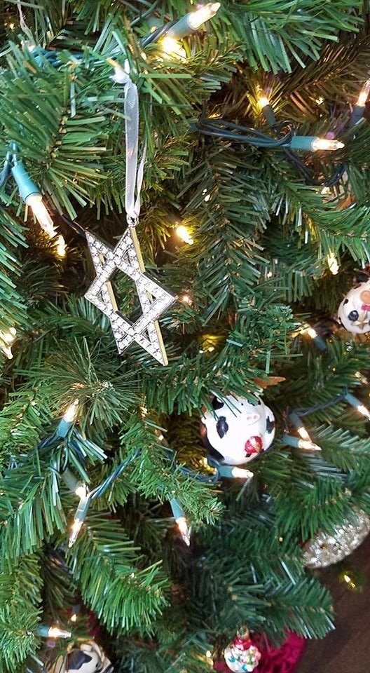 Askar's interfaith tree comes adorned with relics of many religions.