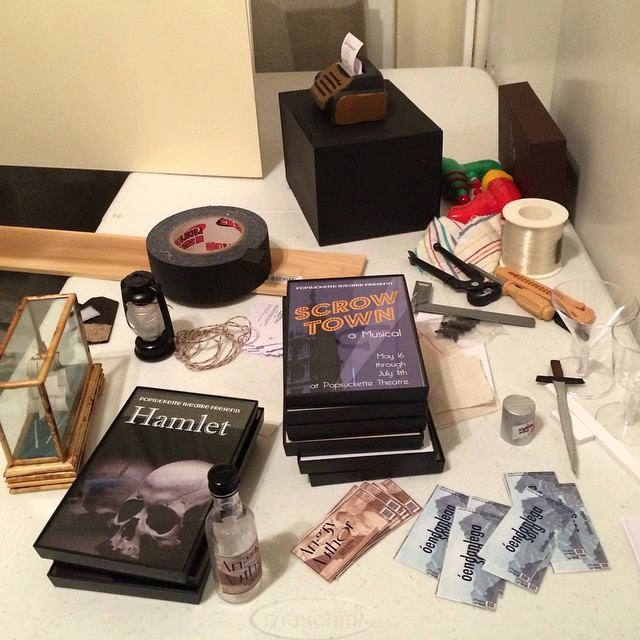 The world of miniature props made from scratch: type writer, tickets, theater posters, liquor bottles and more.