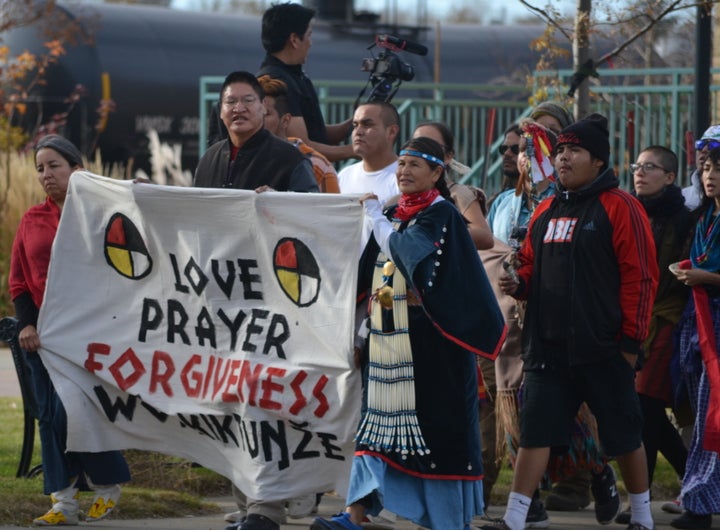 Water protectors on a forgiveness walk, where they prayed for the well-being of law enforcement officers, in Mandan, North Dakota.