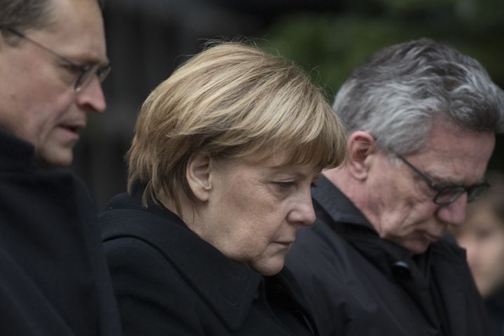 Angela Merkel, Germany's chancellor, mourns at the site of Monday's attack