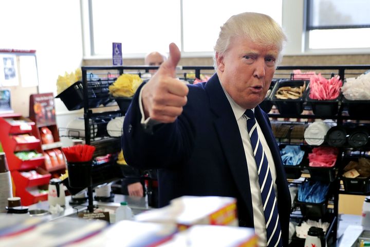 Republican presidential nominee Donald Trump gives a thumbs up to a reporter while stopping for snack food at a Wawa gas station November 1, 2016 in Valley Forge, Pennsylvania.