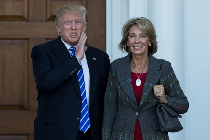 President-elect Donald Trump and his nominee for education secretary, Betsy DeVos, pose for a photo after their meeting at Trump International Golf Clubon Nov. 19. DeVos is a big supporter of school voucher programs. 