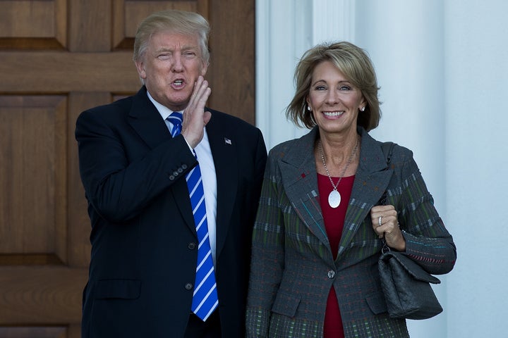 President-elect Donald Trump and his nominee for education secretary, Betsy DeVos, pose for a photo after their meeting at Trump International Golf Clubon Nov. 19. DeVos is a big supporter of school voucher programs.