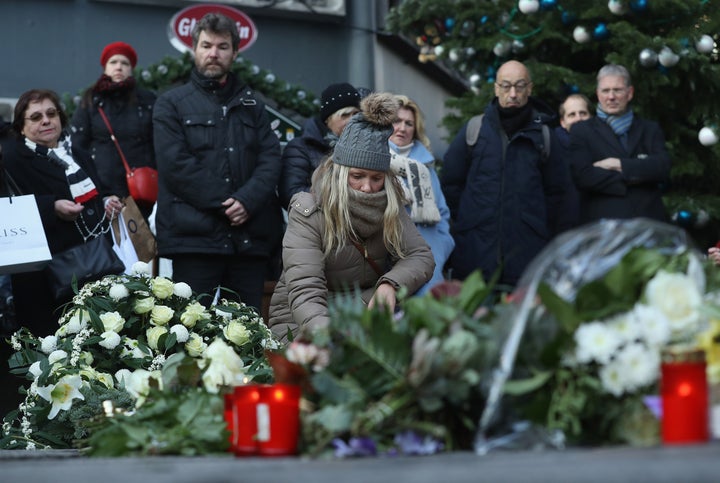 <strong>Mourners lay flowers and candles at a makeshift memorial at the site of the attack </strong>