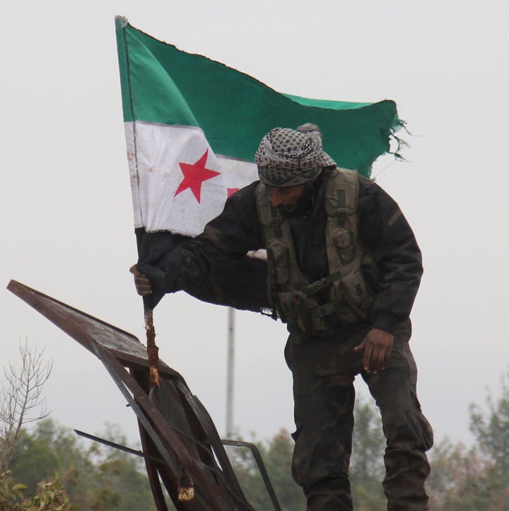 Convoys carried opposition fighters out of the last rebel pocket of Aleppo on Thursday.