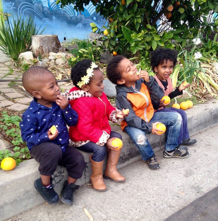 <p>Curbside Kids Enjoying the fruit of Ron Finley’s labor. </p>