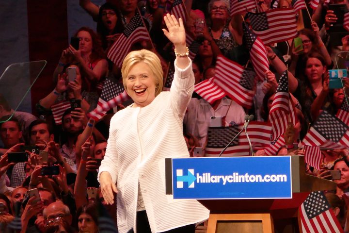 Hillary Clinton accepts the Democratic Party nomination, clad all in white in June.