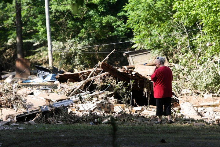 Emma Allen, 58, looks at the remnants of her damaged home after flooding in Falling Rock, West Virginia.