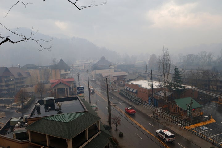 Smoke fills the air and surrounds businesses and resorts in the wake of a wildfire in downtown Gatlinburg, Tennessee, Nov. 30, 2016.