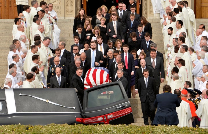 Pallbearers carry the casket of U.S. Supreme Court Associate Justice Antonin Scalia out of his funeral mass at the Basilica of the National Shrine of the Immaculate Conception in Washington, February 20, 2016.