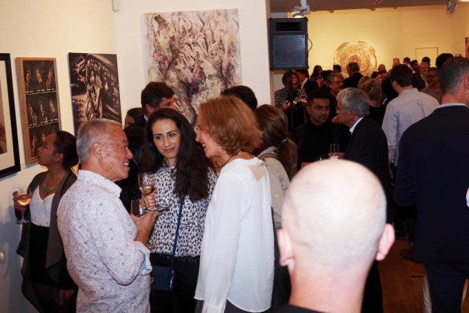 ArtGemini Prize founder and organizer Jimmy Lek (second from left in white shirt) chatting with participants during one of th