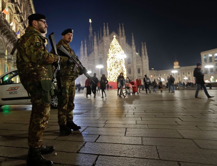 Italian soldiers patrol next to Milan's gothic cathedral, Italy, Thursday, Dec. 22, 2016. Following the truck attack on a Christmas market in Berlin.