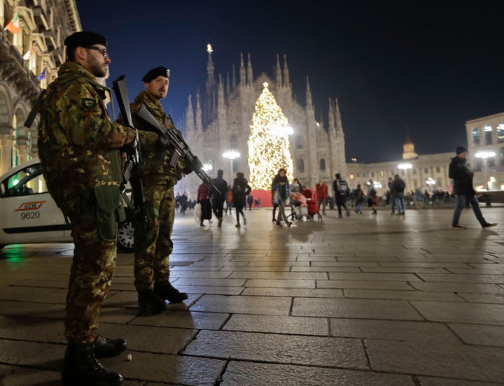 Italian soldiers patrol next to Milan's gothic cathedral, Italy, Thursday, Dec. 22, 2016. Following the truck attack on a Christmas market in Berlin.