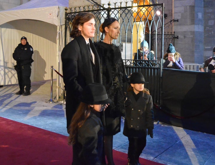 <strong>Celine was supported at her husband's funeral by her three sons, Rene-Charles and twins Nelson and Eddy</strong>