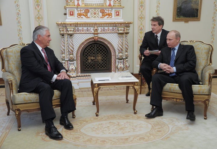 Then Russian Prime Minister Vladimir Putin and Exxon Mobil Chief Executive Rex Tillerson, Trump's secretary of state pick, meet in Russia in 2012.