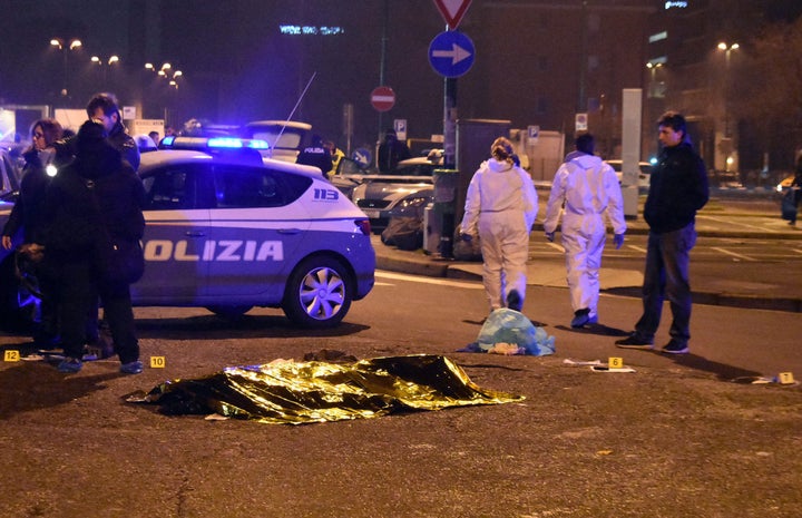 <strong>A body is covered with a thermic blanket after the shootout.</strong>